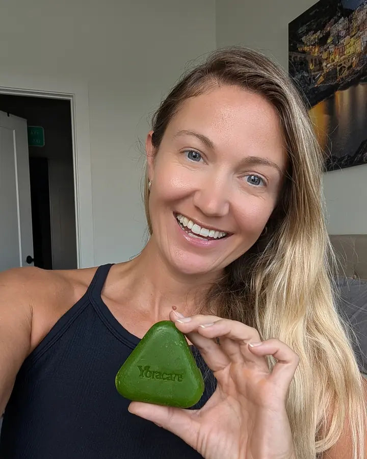 Content creator showing the Yoracare shampoo bar in their bathroom