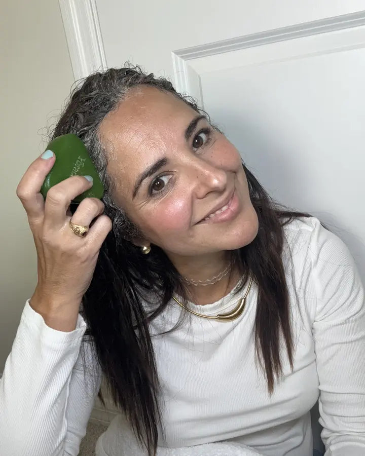Content creator showing the Yoracare shampoo bar in their bathroom