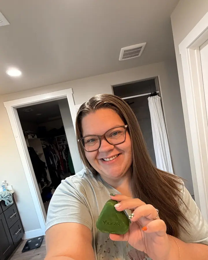 Content creator showing the Yoracare shampoo bar in their bathroom