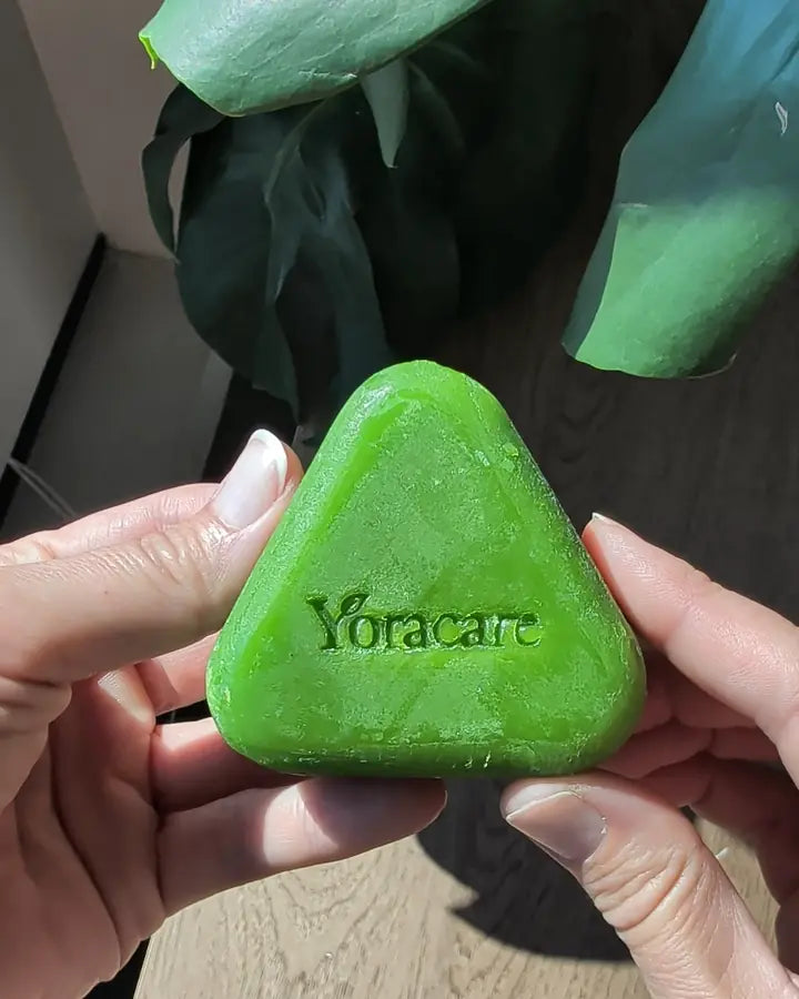 Content creator showing the Yoracare shampoo bar in their bathroom