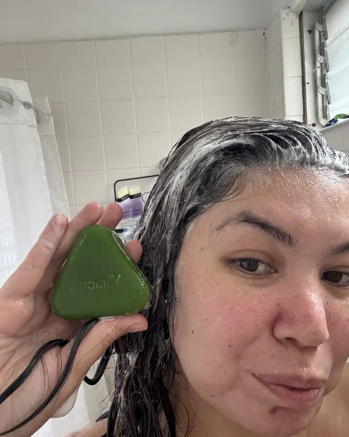 Content creator showing the Yoracare shampoo bar in their bathroom
