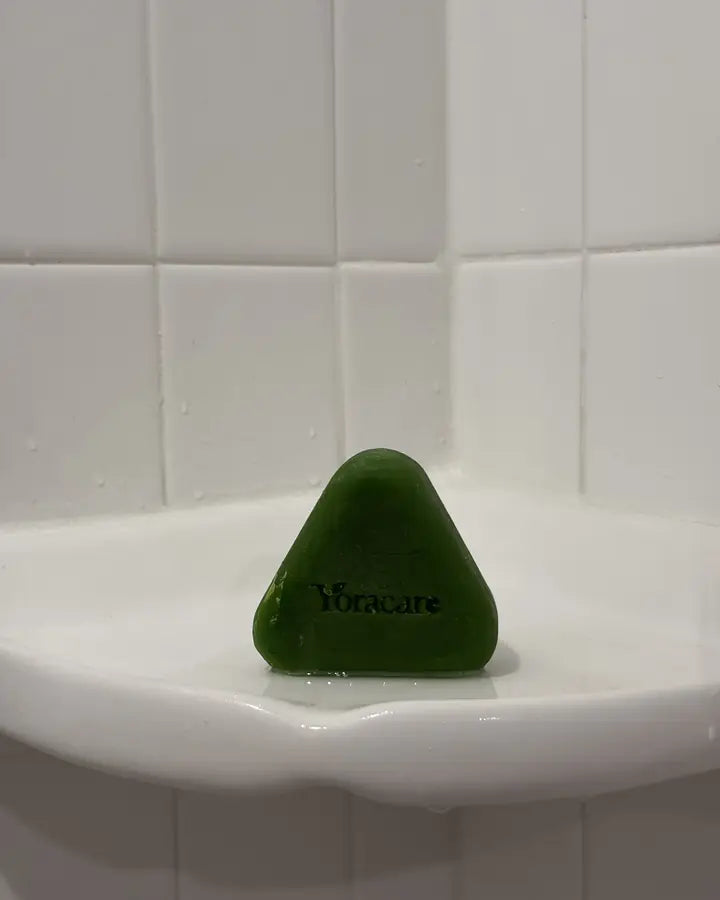 Content creator showing the Yoracare shampoo bar in their bathroom